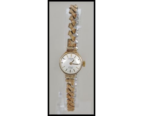 A 9ct&nbsp; / 375 gold hallmarked ladies Rotary cocktail dress watch with expanding yellow metal bracelet. Weight 16g