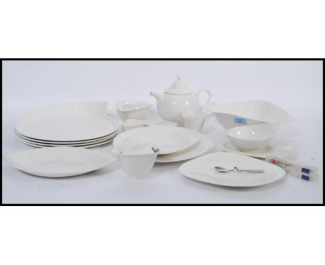 A Villeroy &amp; Boch ' New Wave Premium ' part dinner and tea service, consisting of tea pot, serving plates, sugar bowl, cr