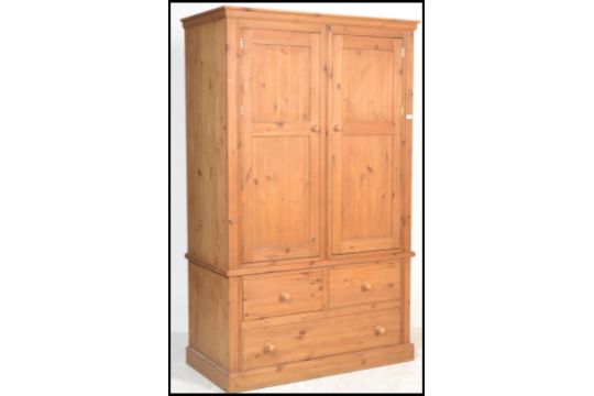 An Antiques Style Large Country Pine Double Wardrobe Raised On A