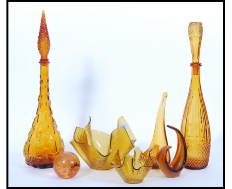 A collection of vintage retro 20h century amber glass studio art glass to include two Italian Genie bottle decanters, handker