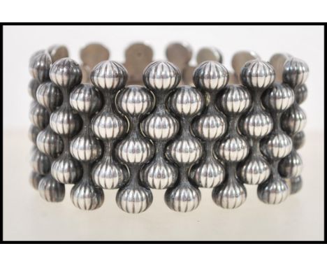 A sterling silver Georg Jensen bracelet by&nbsp;Arno Malinowski, Onion design, no. 110 from 1956. Fully marked see images. We