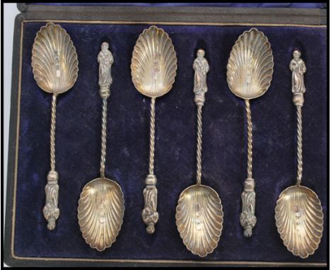 A set of six 19th century Victorian hallmarked silver Apostle teaspoons / tea spoons. Scalloped shell bowls with twisted stem