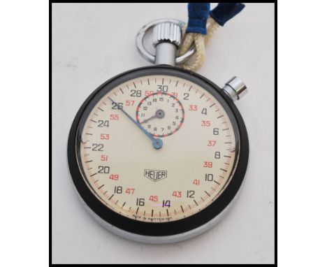 A vintage 20th century Tag Heuer stopwatch timer complete in original box. White enamel face with faceted hands, red and blac