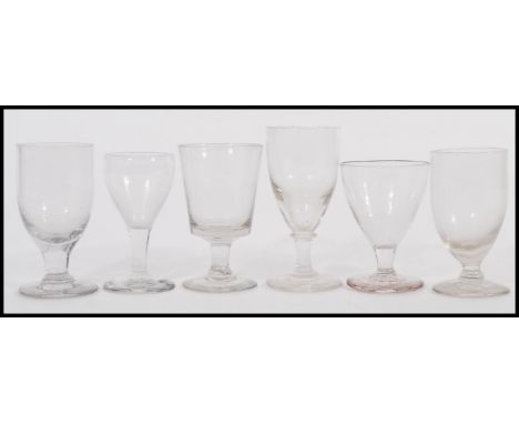 A harlequin set of small rummer glasses dating from the early 19th Century to include Georgian and Victorian examples includi