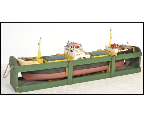 A very large scratch built wooden and metal model of a boat with inset engine complete with transportation carry case. Hand p
