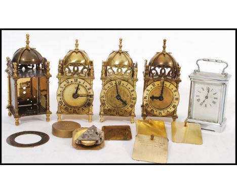 A group of vintage Smiths Bell top clocks having brass finials and Roman numeral chapterrings along with a white metal carria