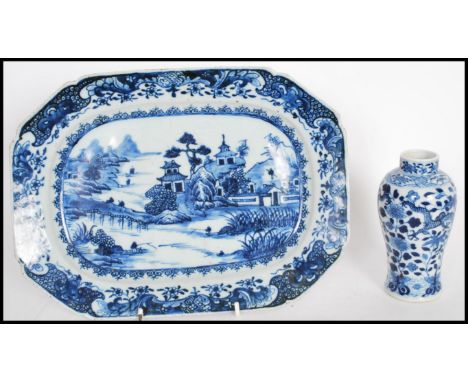 An 18th Century ceramic tray hand painted in a blue and white pattern with a landscape scene to the plate, along with a small