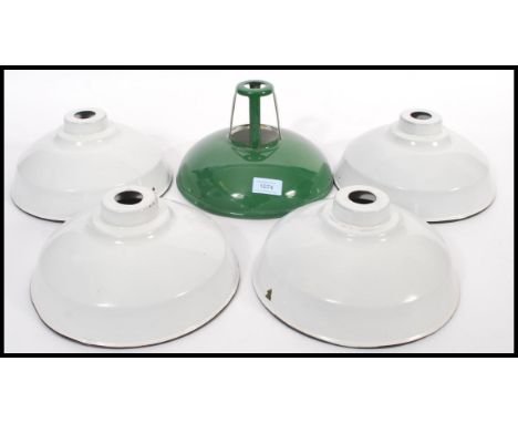 A collection of vintage 20th Century industrial factory enamelled ceiling pendant light shades / lampshades to include four s