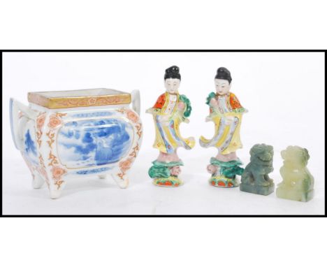 A selection of Chinese ceramics to include a pair of figurines depicting women in traditional dress, a censor pot having hand