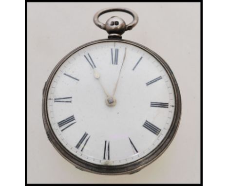 A 19th century Victorian silver hallmarked pocket watch having a fusee movement. The white enamel face having a Roman numeral