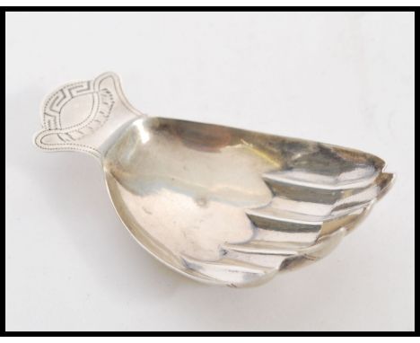 A stunning silver hall marked caddy spoon in the form of a hand, Birmingham assay mark, dating to 1806 with believed makers m