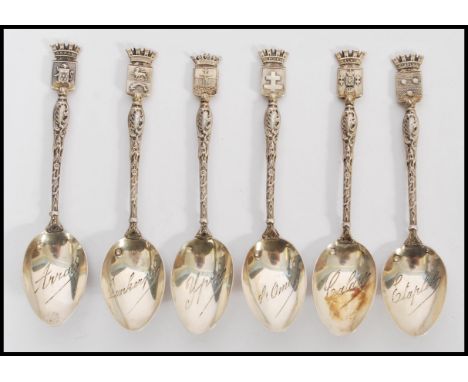 A collection of six French silver hallmarked souvenir tea spoons, the spoons with town crests to the top and each bowl etched