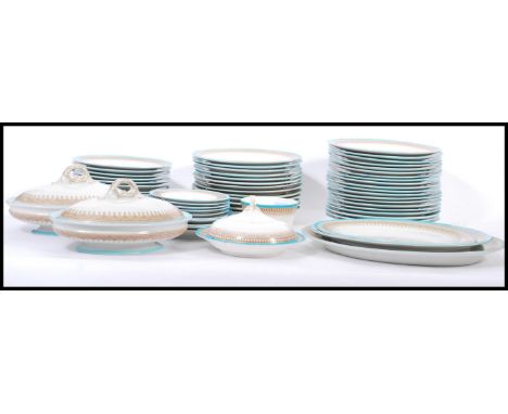 A extensive vintage Royal Worcester Vitreous dinner service, the service decorated with a turquoise band,brown geometric bord