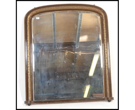 A Victorian 19th century large overmantel mirror having a giltwood large frame with arched top and mirror set to centre. Rais