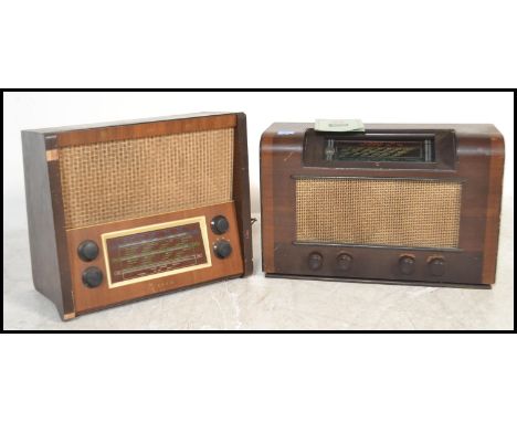 Two 1940's walnut cased valve radios, each with decorative facia and dials, one in light walnut, the other dark. Both with ba