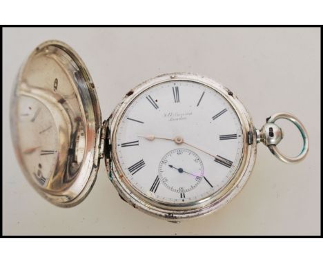 A 19th century Victorian silver hallmarked full hunter pocket watch having a key wind movement. The white enamel face having 