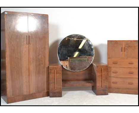 A stunning 20th Century Art Deco 1930's walnut matching bedroom suite comprising of a double wardrobe, drop centre dressing t