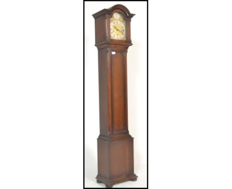A good quality oak cased tempus fugit grandmother clock. The oak trunk and hood with inset gilt brass and silvered face havin