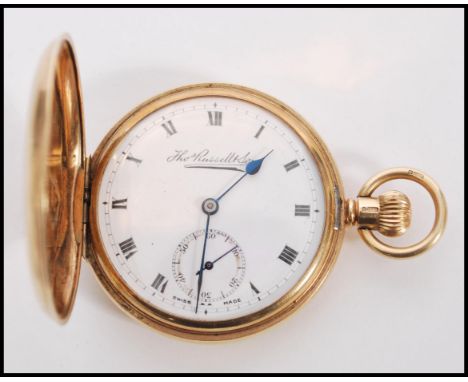 A vintage 20th century hallmarked 9ct gold full hunter pocket watch by Thos Russel and Son complete in fitted box. The white 