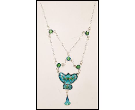 A stamped sterling silver necklace in the Art Nouveau style having blue and green enamelled panels on a spring ring clasp. We