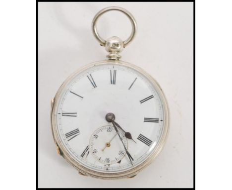 A 19th century Victorian silver hallmarked pocket watch having a fusee movement. The white enamel face having a Roman numeral