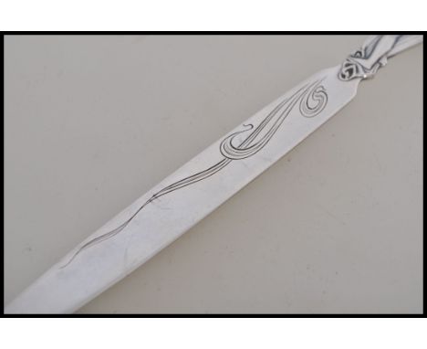An early 20th century silver plated German letter opener paper knife stamped Wilkens 90. Art Nouveau influences handle in the