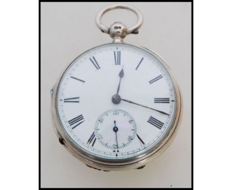 A 19th century Victorian silver hallmarked pocket watch having a fusee movement. The white enamel face having a Roman numeral