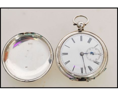 A 19th century Victorian silver hallmarked full hunter pocket watch having a fusee movement. The white enamel face having a R