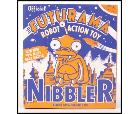 A Futurama ' Official Robot Action Toy ' figure of ' Nibbler '. Tinplate classic style clockwork robot. Appears mint, as new 
