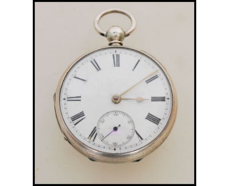 A 19th century Victorian silver hallmarked pocket watch having a fusee movement. The white enamel face having a Roman numeral