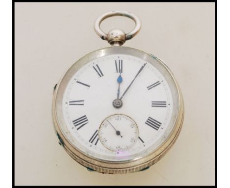 A 19th century Victorian silver hallmarked pocket watch having a fusee movement. The white enamel face having a Roman numeral