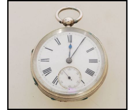 A 19th century Victorian silver hallmarked pocket watch having a fusee movement. The white enamel face having a Roman numeral