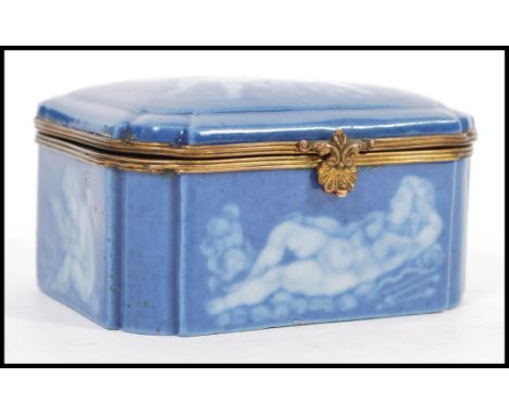 An early 20th Century continental German porcelain blue ceramic casket / trinket box with a pat sur-pat design featuring cher