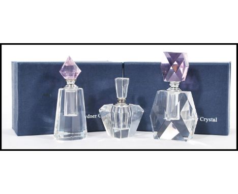 A group of three vintage 20th century Art Deco influence faceted glass perfume bottles having faceted glass stoppers. 12cm hi