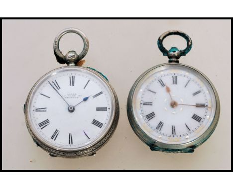 Two 19th century small ladies silver pocket fob watches both having white enamel faces with Roman numeral chapter rings and f