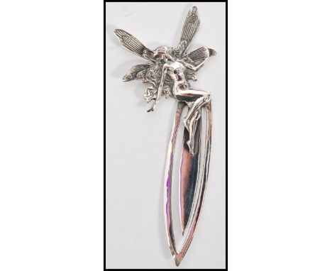 A stamped 925 silver bookmark with a fairy finial to the top. Total weight 11.9g.