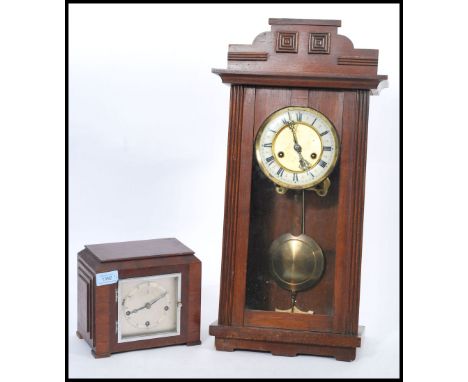 Two vintage early 20th century cased clocks to include a wall hanging mahogany clock with white enamel face Roman numeral cha