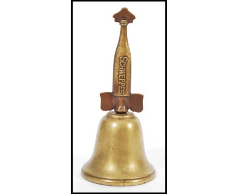 A vintage 20th century advertising countertop bell for Schweppes and Co with brass finial handle. 15cm high 6cm diameter.&nbs