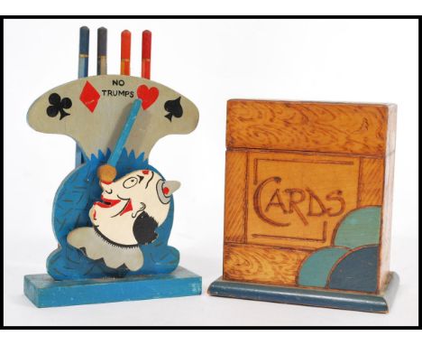 A vintage early 20th century Art Deco card box complete with cards along with a suite pencil selector in the form of a clown.