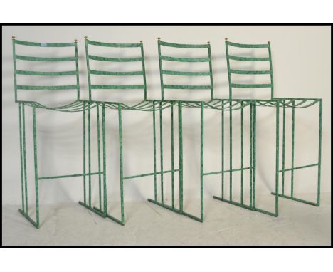 A set of four breakfast / bar / outdoor / garden stools, constructed from metal with ladder back rests raised on straight sup