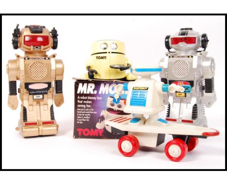 A collection of assorted vintage robot toys to include; 2 x New Bright made Magic Mike smoking robots , Playtime Product made