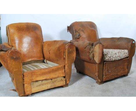 A pair of 1920's rustic French Art Deco leather club / easy / lounge armchairs. The vintage chairs being wooden framed with s