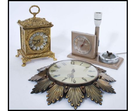 A group of three vintage retro 20th century clocks to include a battery movement antique style brass clock, retro Goblin cloc