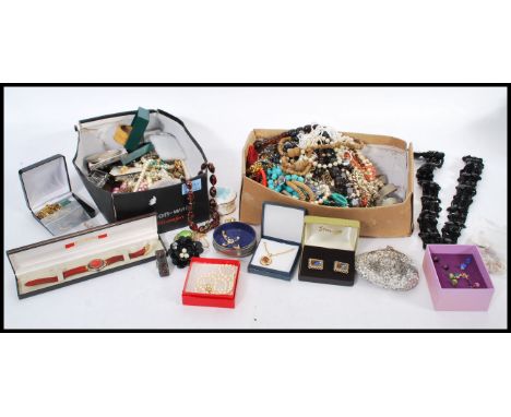 A good selection of vintage costume jewellery to include simulation pearls, a boxed ferrari watch, beaded necklaces, brooches