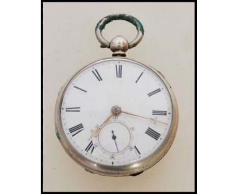 A 19th century Victorian silver hallmarked pocket watch having a fusee movement. The white enamel face having a Roman numeral