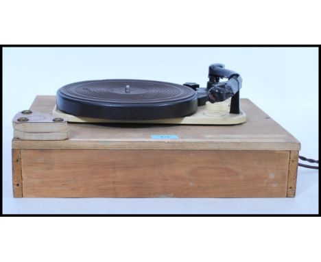A vintage early 20th century Garrard Model T&amp;M Mk II record deck set to a wooden base, the turntable with bakelite arm et