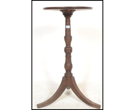 An 18th century George III mahogany wine table. Of tripod form with splayed legs, turned column and circular top above.&nbsp;