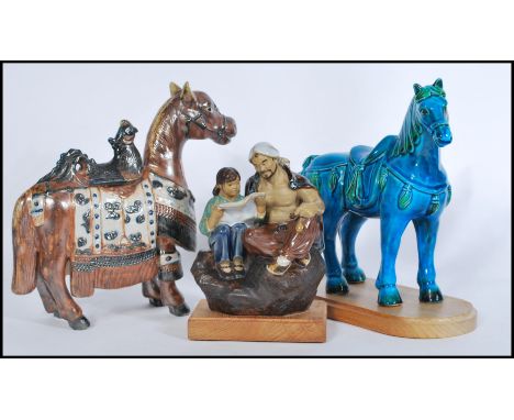 A 20th Century ceramic Tang Dynasty style War Horse, the horse surmounted by a Phoenix, together with another Chinese horse w