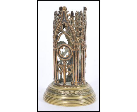 A 19th century Victorian brass pugin Gothic ecclesiastical night light of tall pierced cylindrical form. 14cm high 8cm diamet