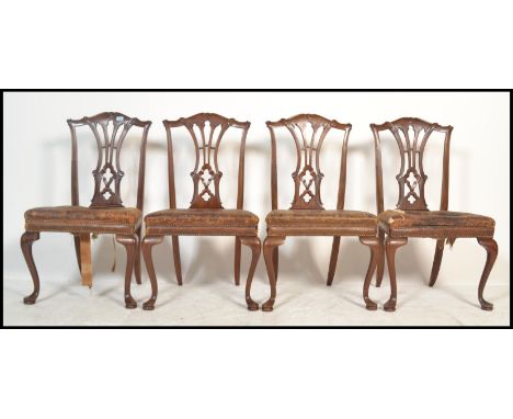 A set of four 19th Century Chippendale revival large mahogany dining chairs, each raised on cabriole legs with studded leathe